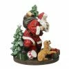 Roman 8.75" Tiptoeing Santa With Smiling Dog Christmas Tabletop Figurine